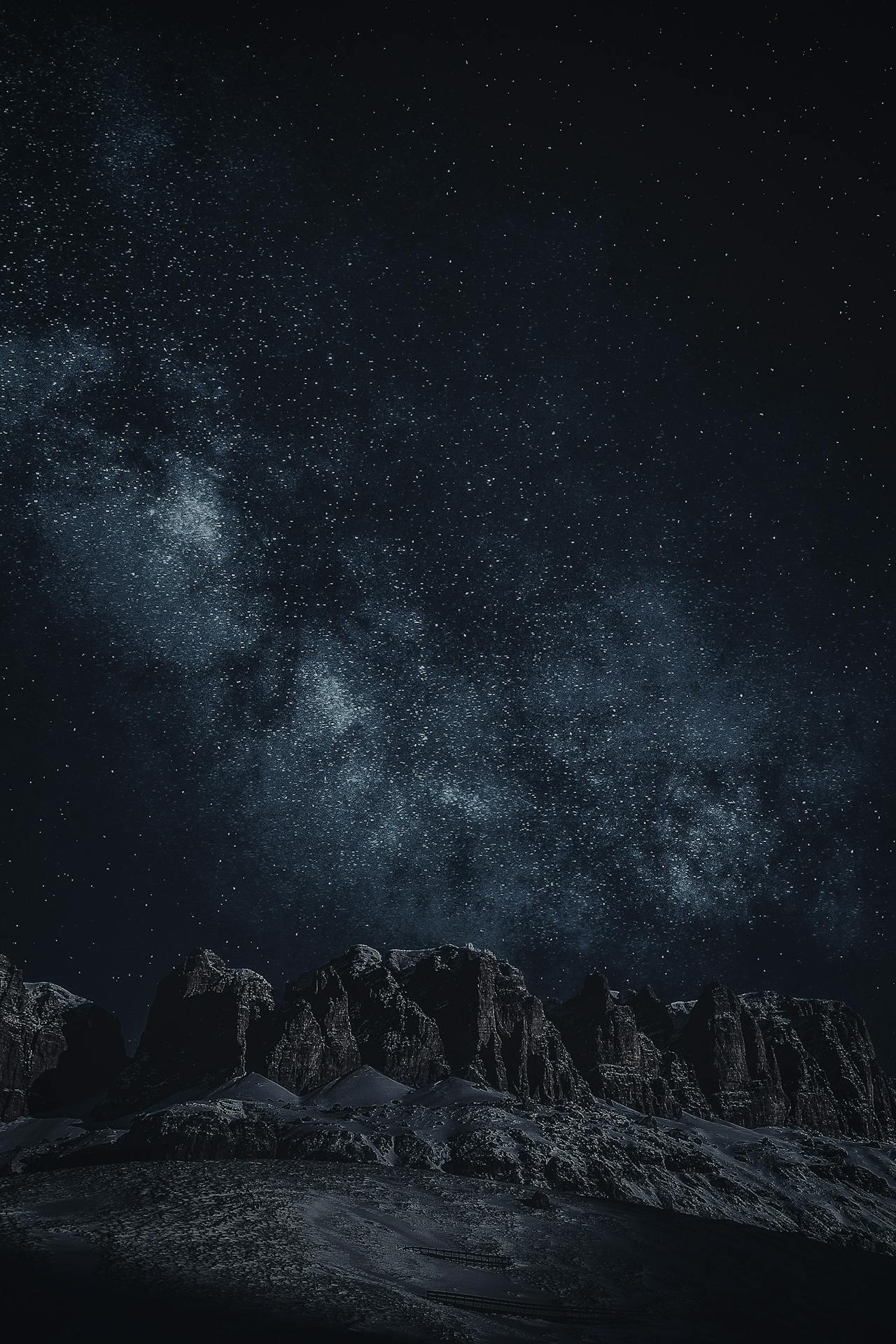 Starry sky with Milky Way over mountains